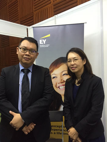 Ernst & Young Senior Manager, Tax Anne Chong (right) posing with a colleague.