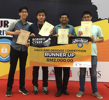 (from left) Yong, Son, Dr. Valliappan and Tan with their prize money and certificates of participation.