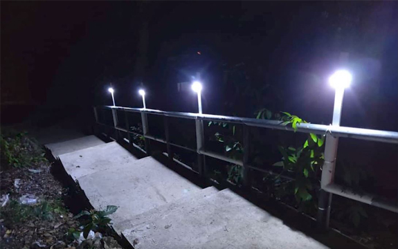 Solar lights brighten main pathways at night.