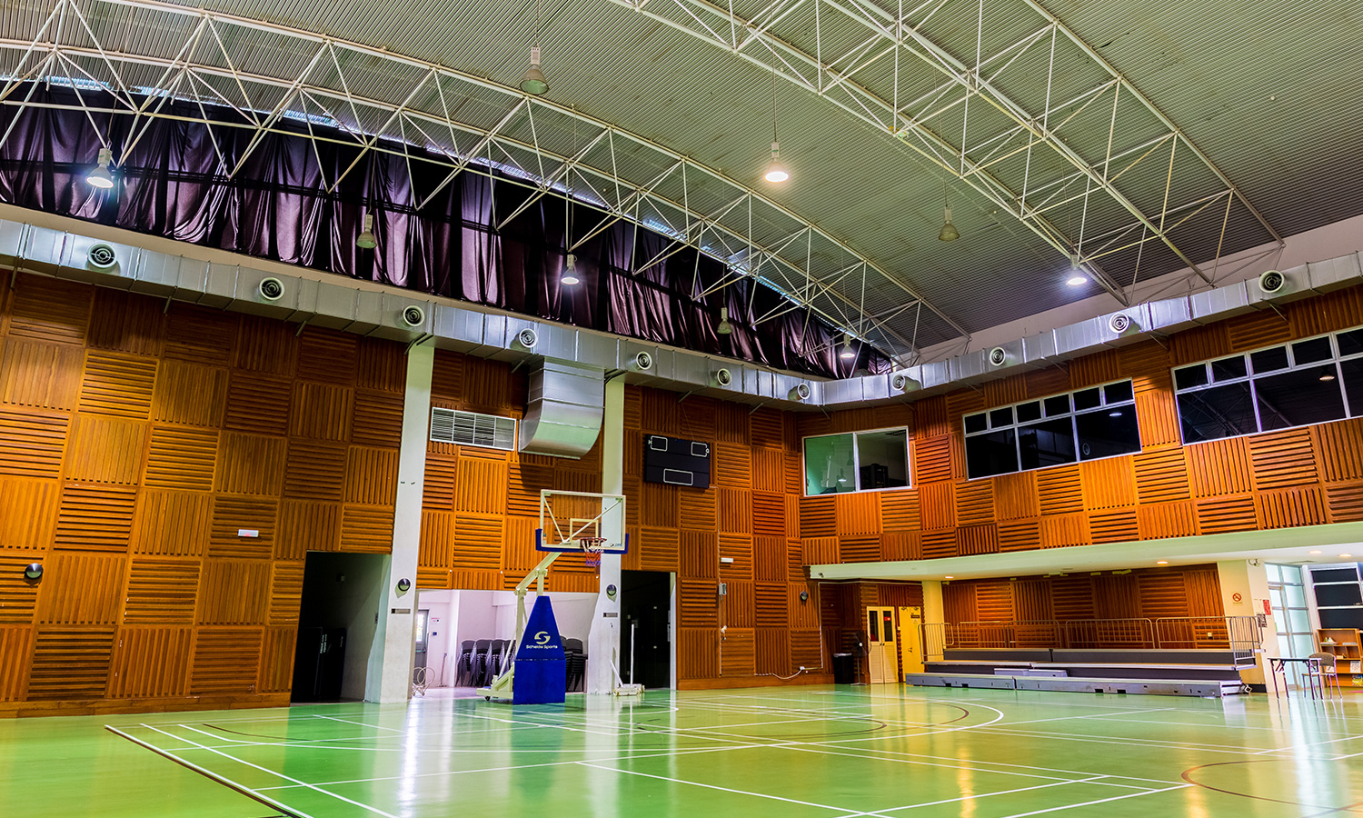 Multi-Purpose Hall with recreational facilities such as a basketball court, squash courts, badminton courts and a gym.