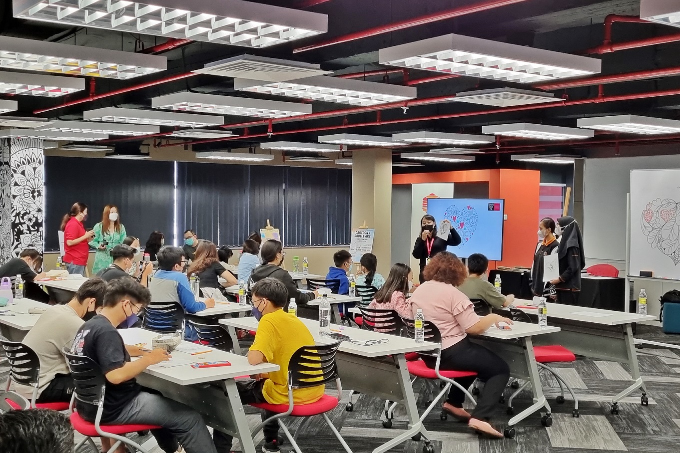 Students taking part in the face-to-face doodle art workshop held at The Hive Design Studio, Swinburne Sarawak.