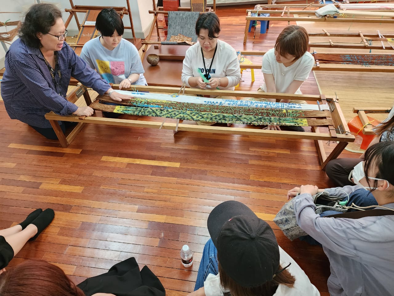 The KUIS students visit the Tun Jugah Foundation to learn about beadwork and weaving.