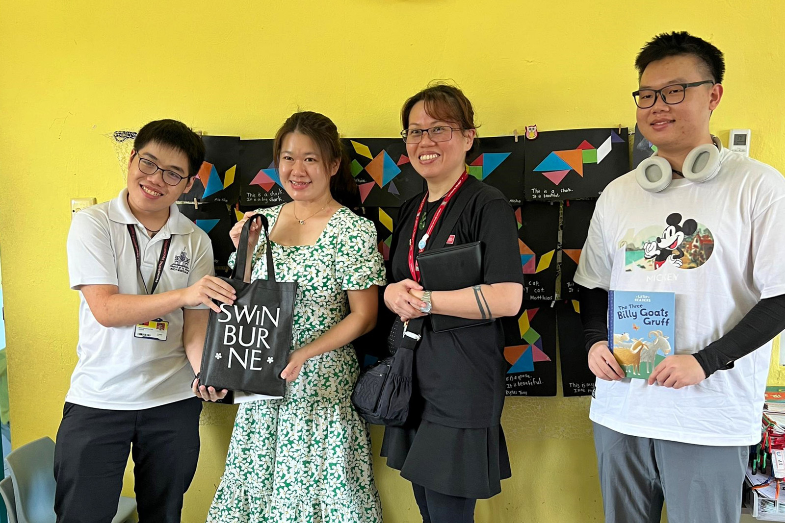 A token of appreciation from Swinburne Sarawak is presented to Ms Wong (second left) as Ms Ting (second right) and others look on. 