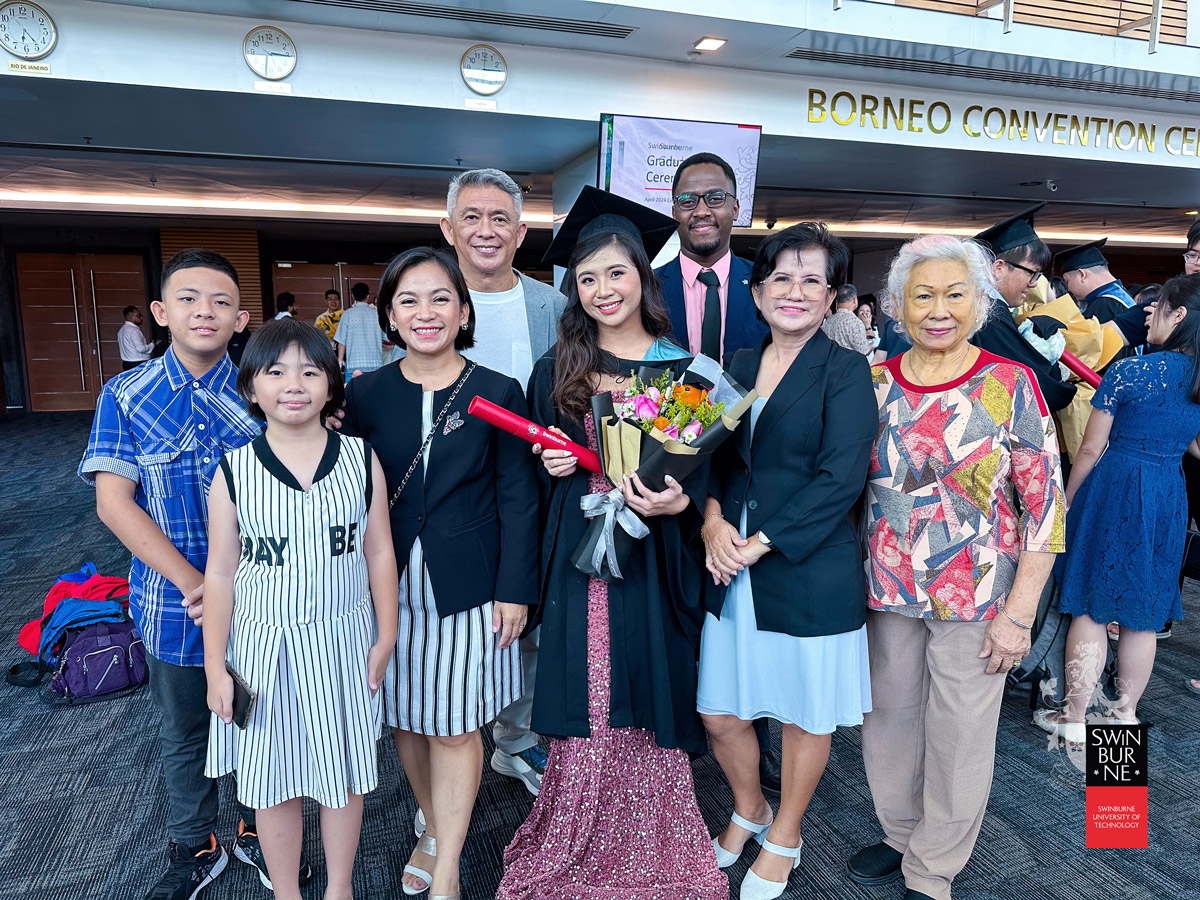 Valedictorian Stephanie Wong Chiew Dee (fourth right) and her family at the graduation ceremony.