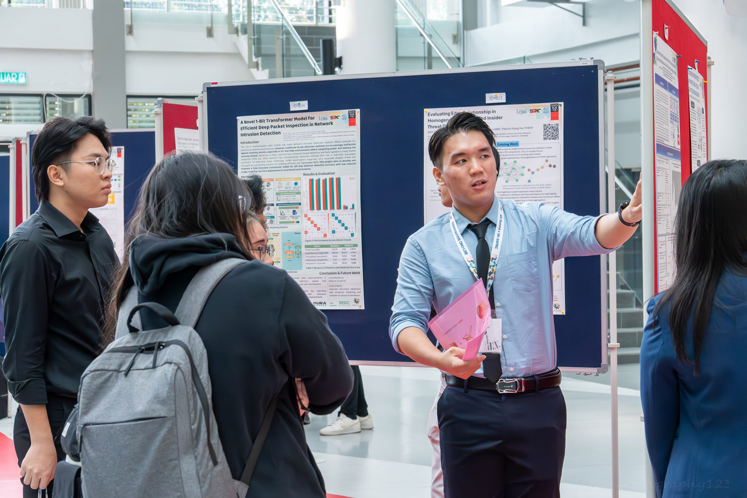 A student presents his research poster to attendees of IUC-SSPRC 2025.