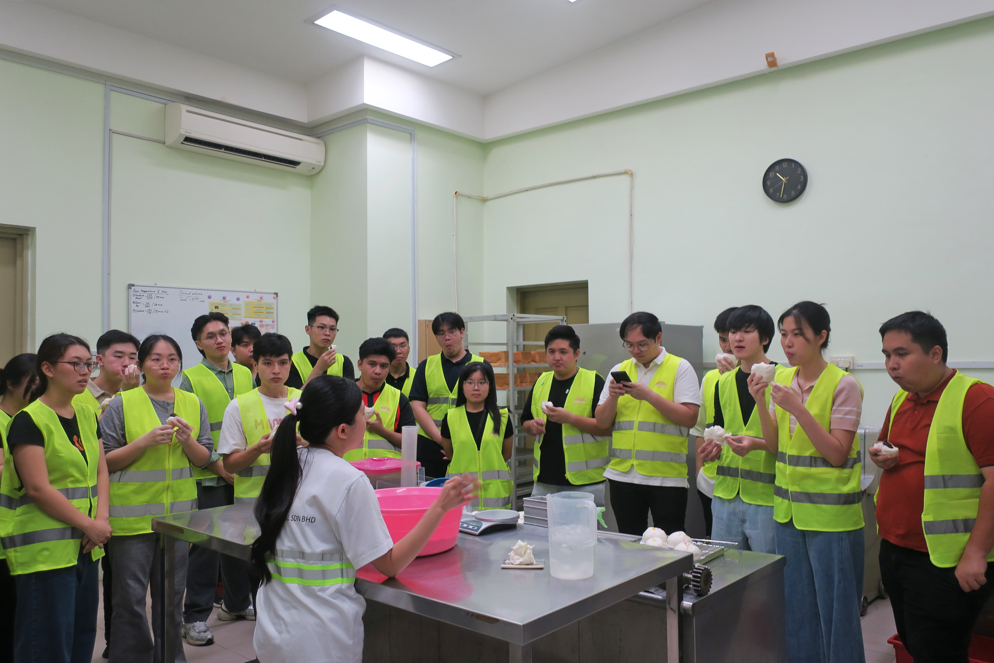 Students sample flour-based food products during the factory tour. 