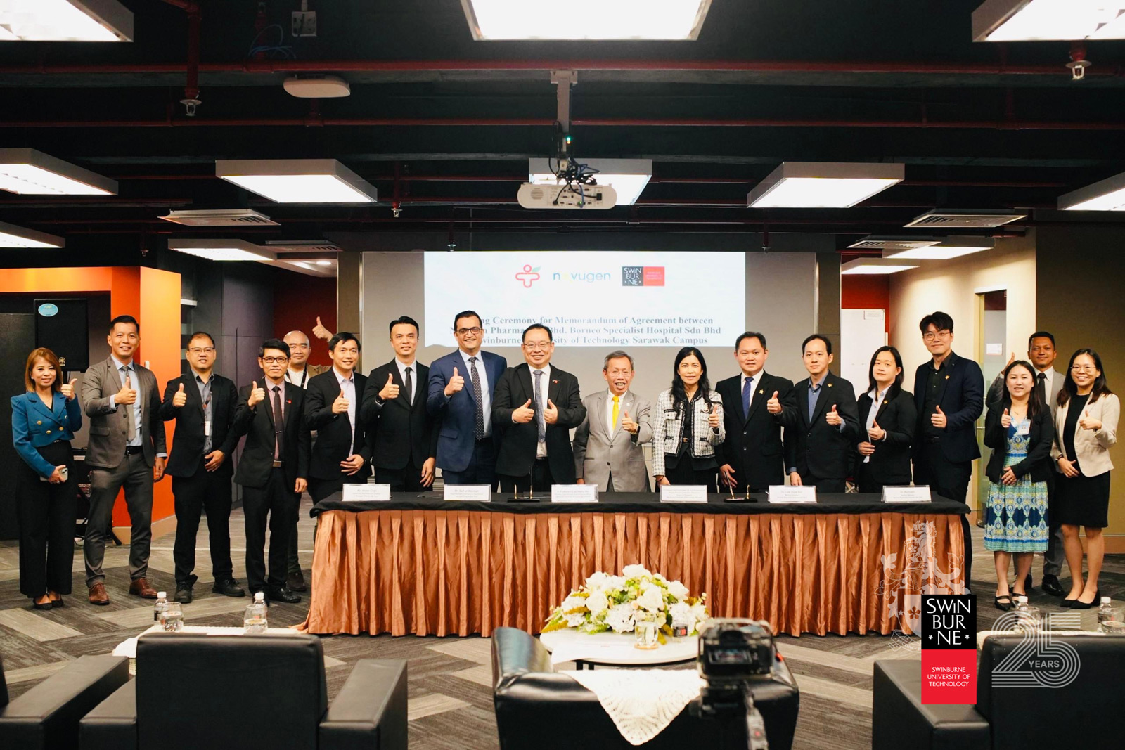 A group photo taken at the MoA signing ceremony. Seen are (front row, from sixth left) Mr Victor Chan, Mr Saif-ur-Rehman, Ir Professor Lau Hieng Ho, The Honourable Datuk Amar Professor Dr Sim Kui Hian, Professor Dr Ida Fatimawati Adi Badiozaman, Dr Law Siew Hor, and Dr Kenneth Tan.