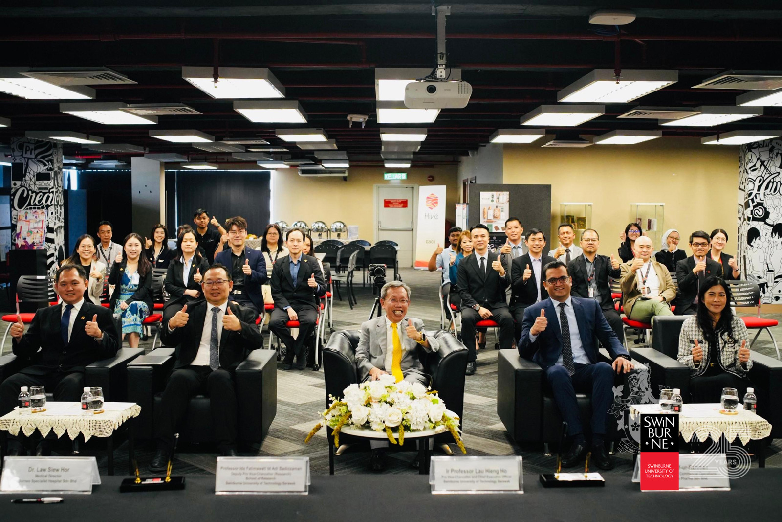 A group photo taken with attendees at the MoA signing ceremony. Seen are (front row, from left) Dr Law Siew Hor, Ir Professor Lau Hieng Ho, The Honourable Datuk Amar Professor Dr Sim Kui Hian, Mr Saif-ur-Rehman, and Professor Dr Ida Fatimawati Adi Badiozaman.