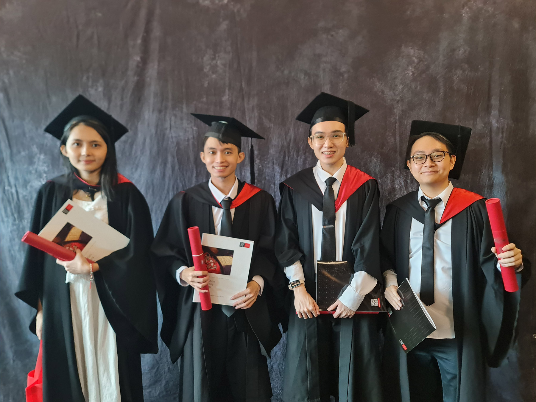 Jaden (second from left) on graduation day with his FYP team members.