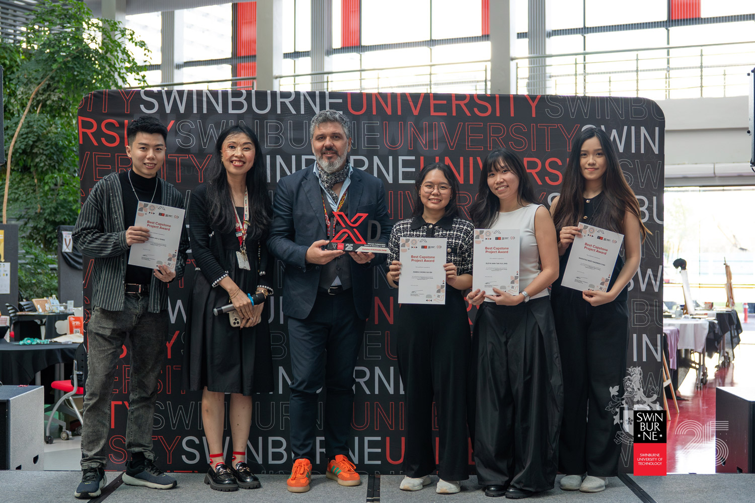 Winners of the Best Capstone Project Award from the Bachelor of Multimedia Design cohort for this semester, with their winning interactive project, “Woven Identities”. Also seen are (from second left) Jasmine Ng and Associate Professor Dr Predrag K Nikolic.