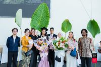 A graduate (fourth from left) with her family and friends. 