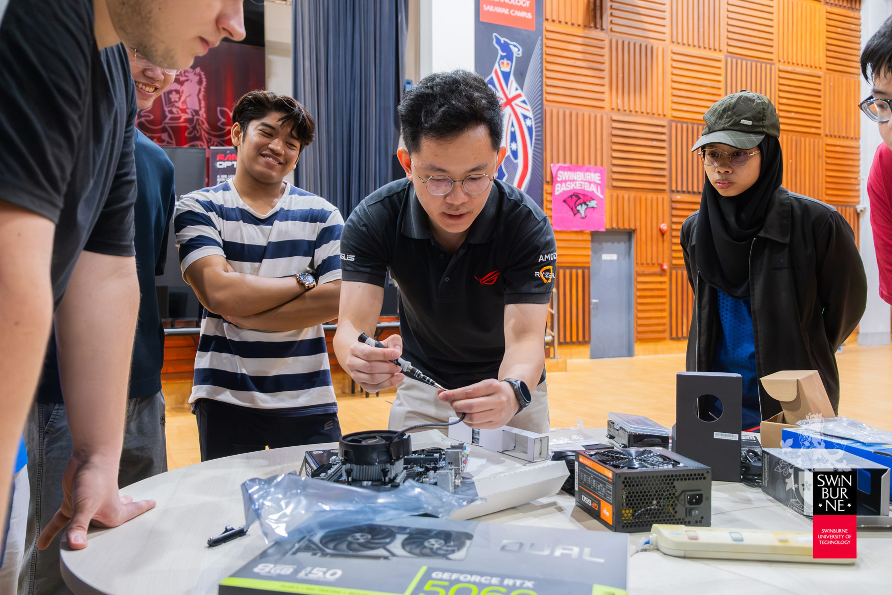 Student participants observe a demonstration.