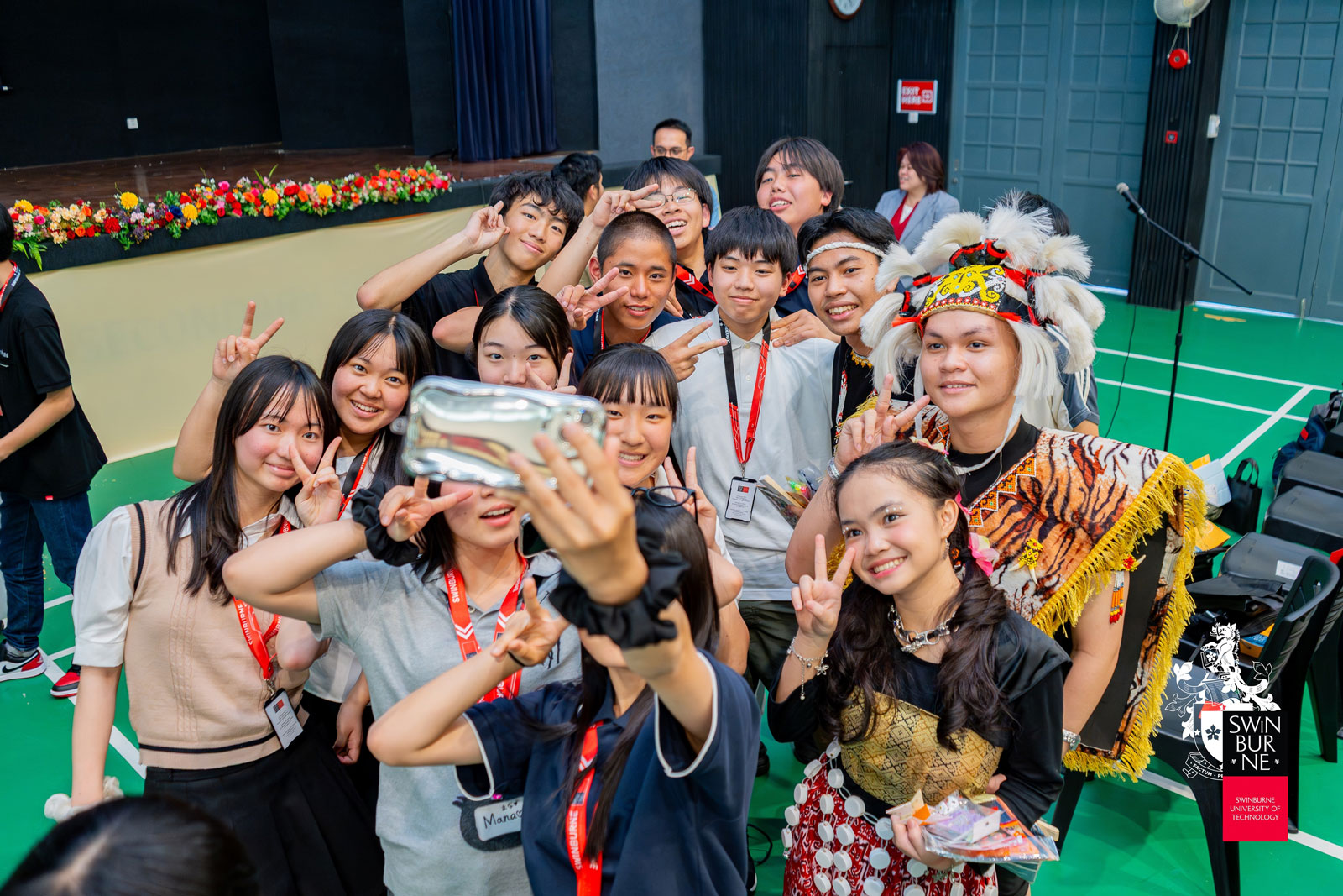 The visiting students from Kindai University Junior and Senior High School take a photo with students from Yayasan Sarawak International Secondary School.
