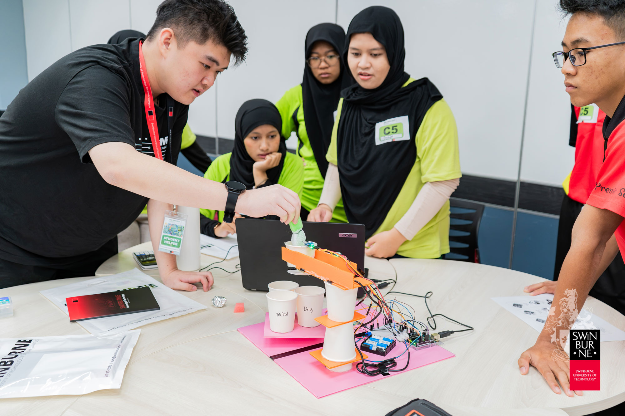 The students discover the role of robotics and automation in solving environmental issues through “EcoBots: Robots for a Greener Tomorrow”.