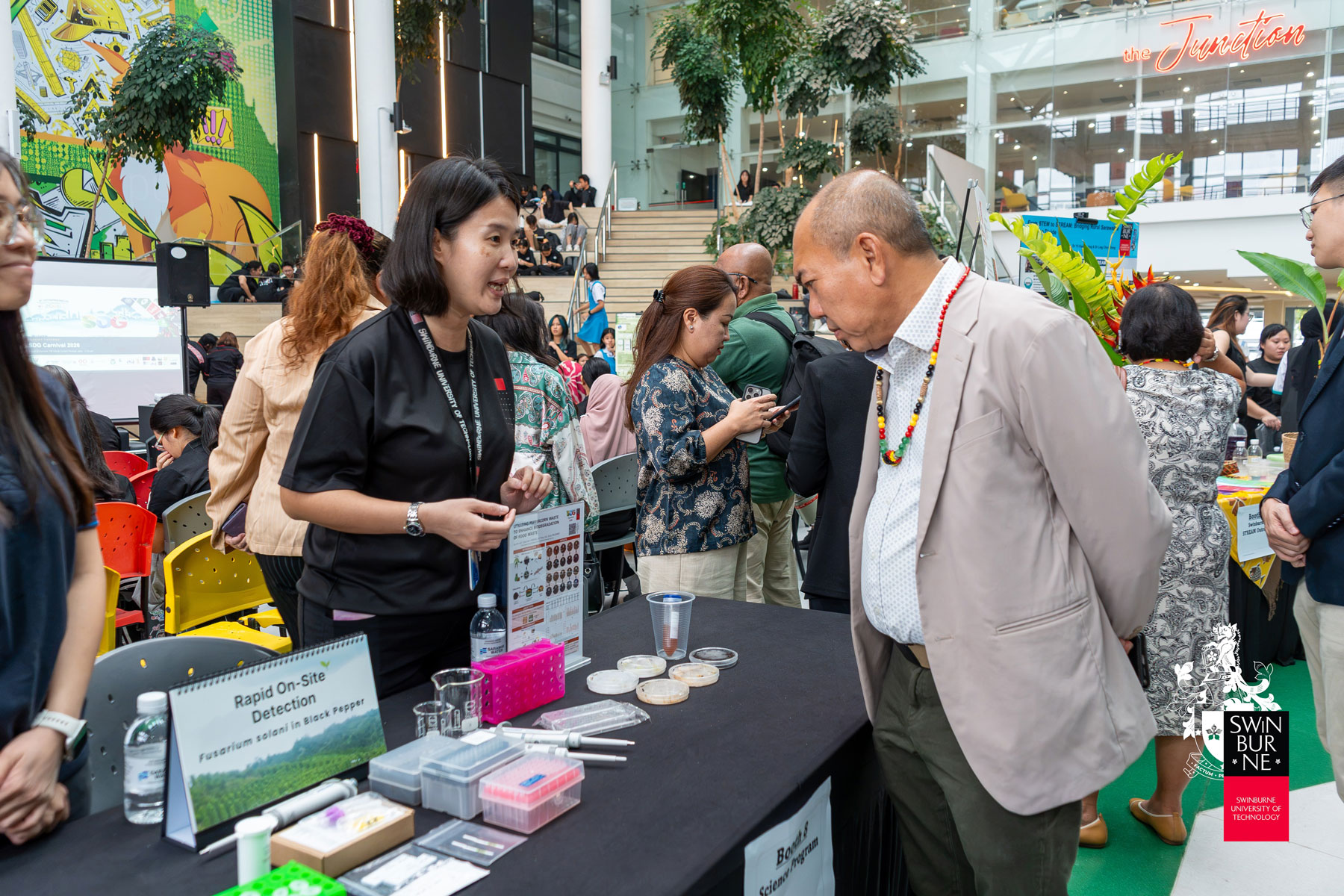 YB Datuk Gerald Rentap Jabu (right) visits one of the exhibitions at the SDG Carnival 2026.